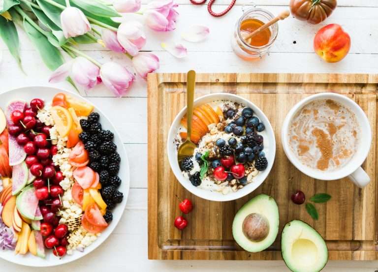 Body Coach and Zoe Science and nutrition. Image shows healthy breakfasts of avocados, fruit, yoghurt and nuts